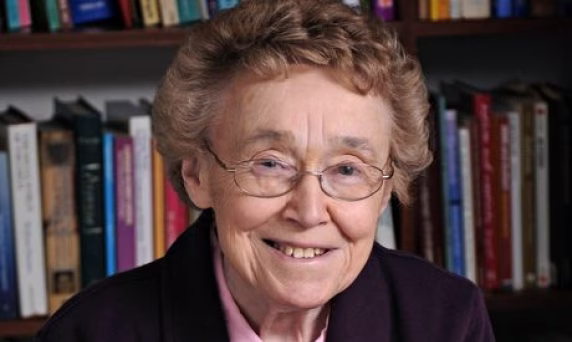Photo of Lorna Wing wearing glasses and smiling.